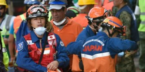 Japanese rescuers take part in the search for survivors at a flattened building in Mexico City on September 22, 2017 three days after a strong quake hit central Mexico. A powerful 7.1 earthquake shook Mexico City on Tuesday, causing panic among the megalopolis' 20 million inhabitants on the 32nd anniversary of a devastating 1985 quake. / AFP PHOTO / Alfredo ESTRELLA        (Photo credit should read ALFREDO ESTRELLA/AFP/Getty Images)
